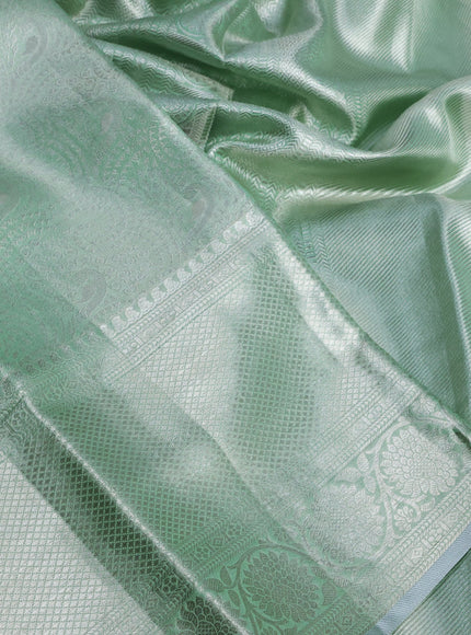 Pure kanchipuram tissue silk saree pastel green with allover silver zari woven brocade weaves and silver zari woven border