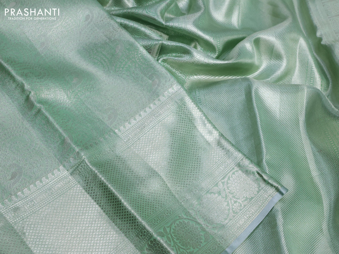 Pure kanchipuram tissue silk saree pastel green with allover silver zari woven brocade weaves and silver zari woven border