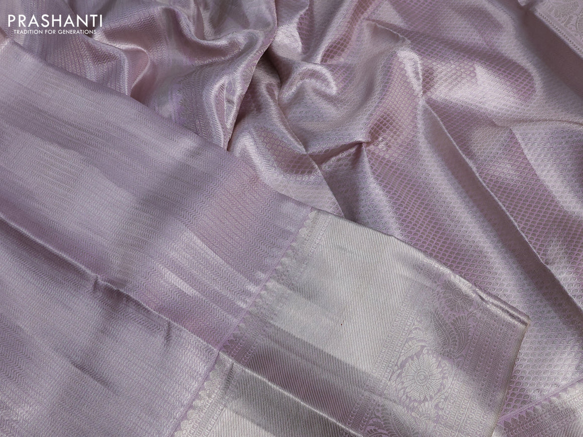 Pure kanchipuram tissue silk saree pastel lavender shade with allover silver zari woven brocade weaves and silver zari woven border