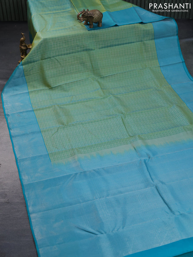 Pure kanchipuram silk saree dual shade of green and teal blue with allover silver zari woven checked pattern and silver zari woven border