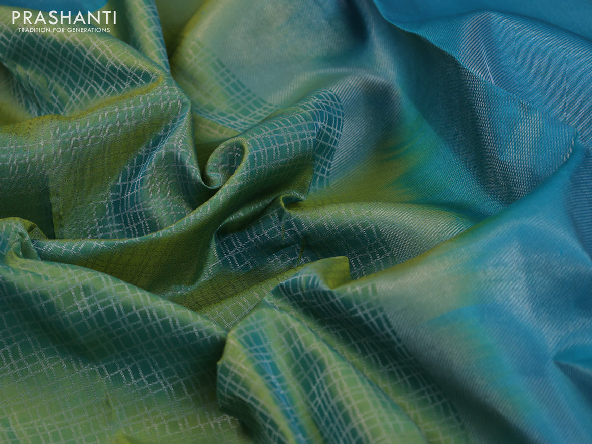 Pure kanchipuram silk saree dual shade of green and teal blue with allover silver zari woven checked pattern and silver zari woven border