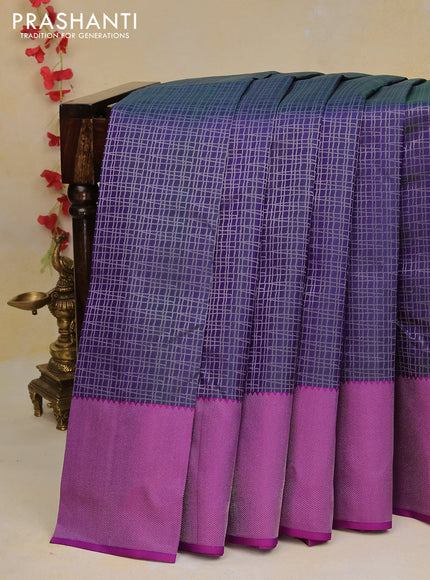 Pure kanchipuram silk saree dual shade of bluish green and purple with allover silver zari woven checked pattern and silver zari woven border