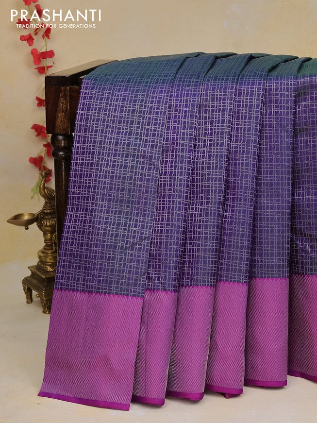 Pure kanchipuram silk saree dual shade of bluish green and purple with allover silver zari woven checked pattern and silver zari woven border