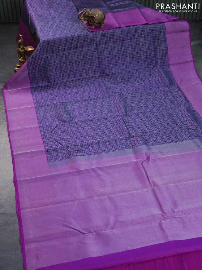 Pure kanchipuram silk saree dual shade of bluish green and purple with allover silver zari woven checked pattern and silver zari woven border