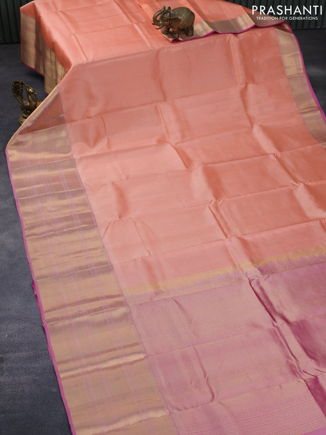 Pure kanchipuram silk saree peach orange and dual shade of pink with plain body and long zari woven border