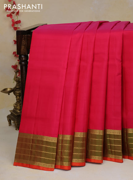 Pure kanchipuram silk saree pink and dual shade of greenish orange with plain body and zari woven border