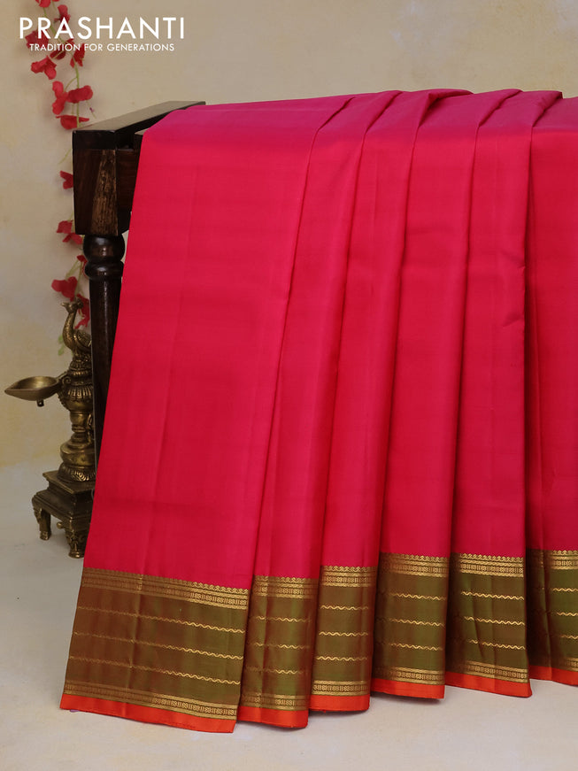 Pure kanchipuram silk saree pink and dual shade of greenish orange with plain body and zari woven border