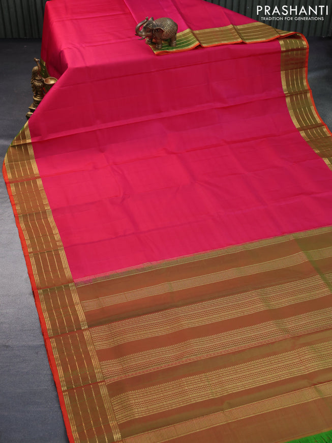 Pure kanchipuram silk saree pink and dual shade of greenish orange with plain body and zari woven border