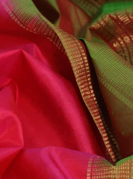 Pure kanchipuram silk saree pink and dual shade of greenish orange with plain body and zari woven border