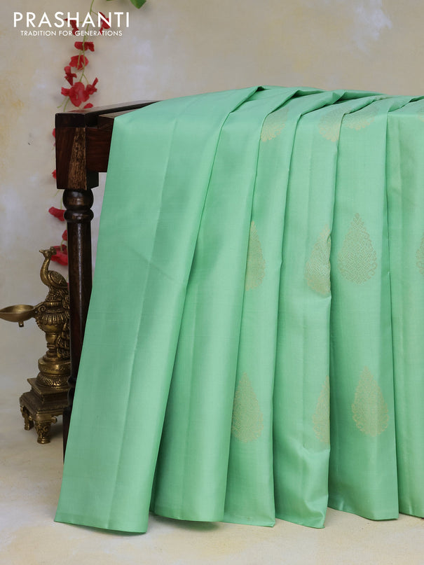 Pure kanchipuram silk saree pastel green and dark green with zari woven buttas in borderless style