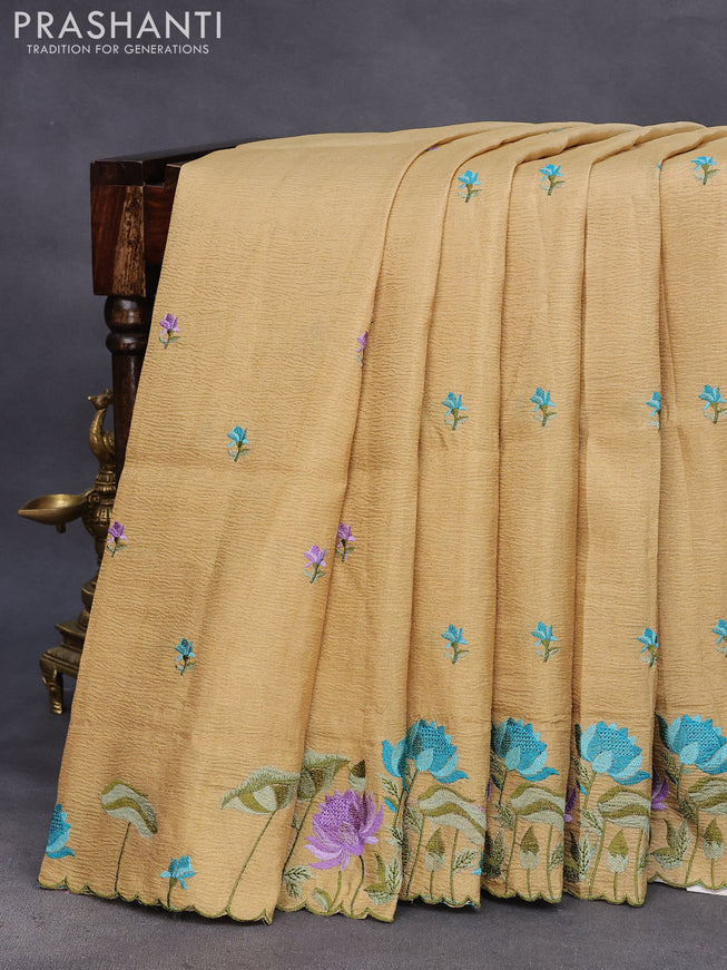 Crush tissue saree beige and elaichi green shade with embroidery work buttas and floral embroidery work border