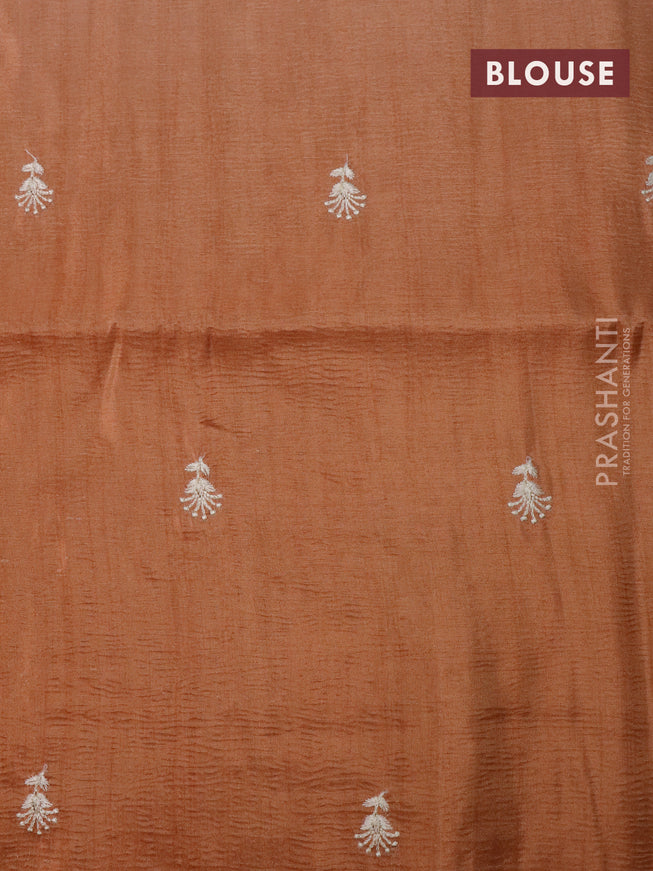 Crush tissue saree rust shade with embroidery work buttas and floral embroidery work border