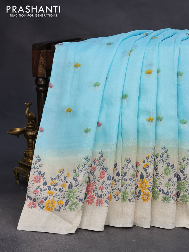 Raw silk saree pastel blue and cream with floral prints & zari buttas and zari woven floral paithani border