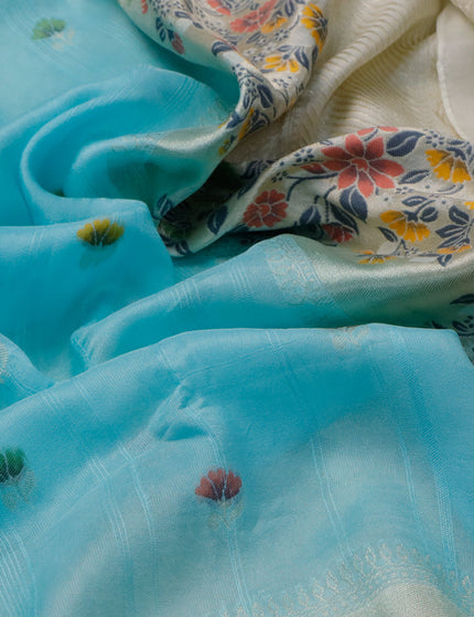 Raw silk saree pastel blue and cream with floral prints & zari buttas and zari woven floral paithani border