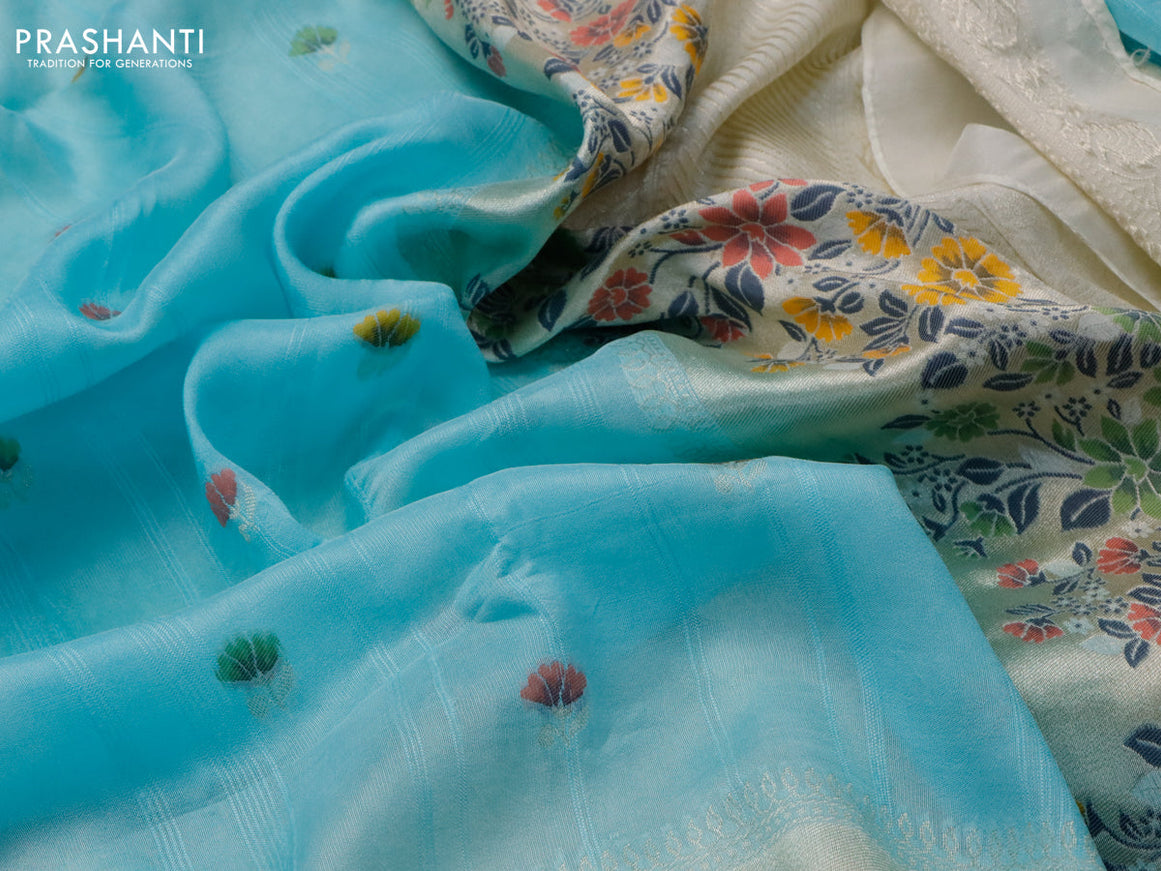 Raw silk saree pastel blue and cream with floral prints & zari buttas and zari woven floral paithani border