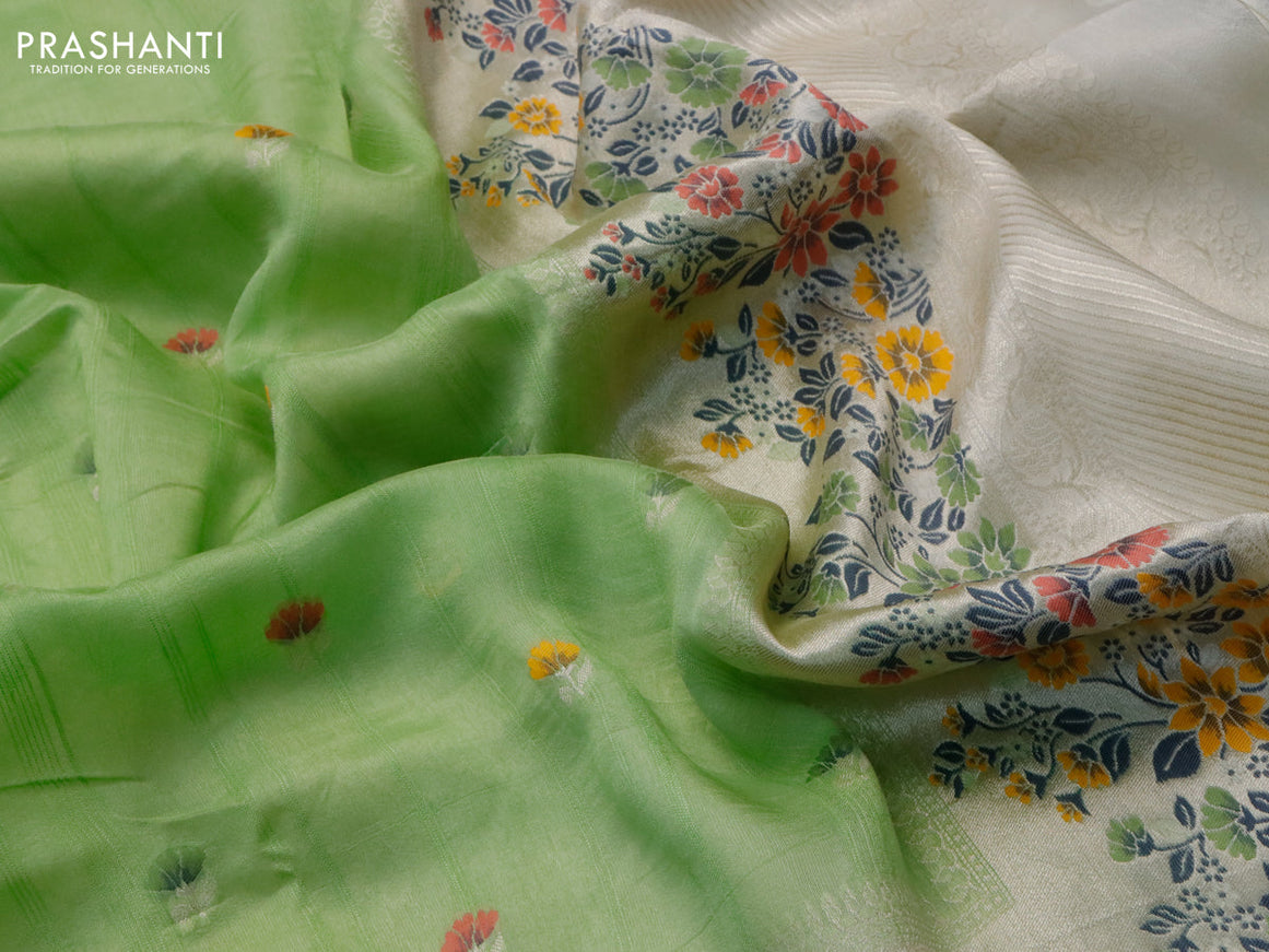 Raw silk saree light green and cream with floral prints & zari buttas and zari woven floral paithani border