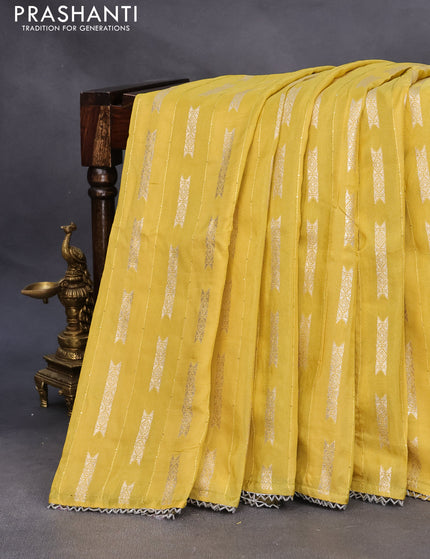 Raw silk saree yellow and mehendi green with allover sequin work & butta weaves and beaded work border