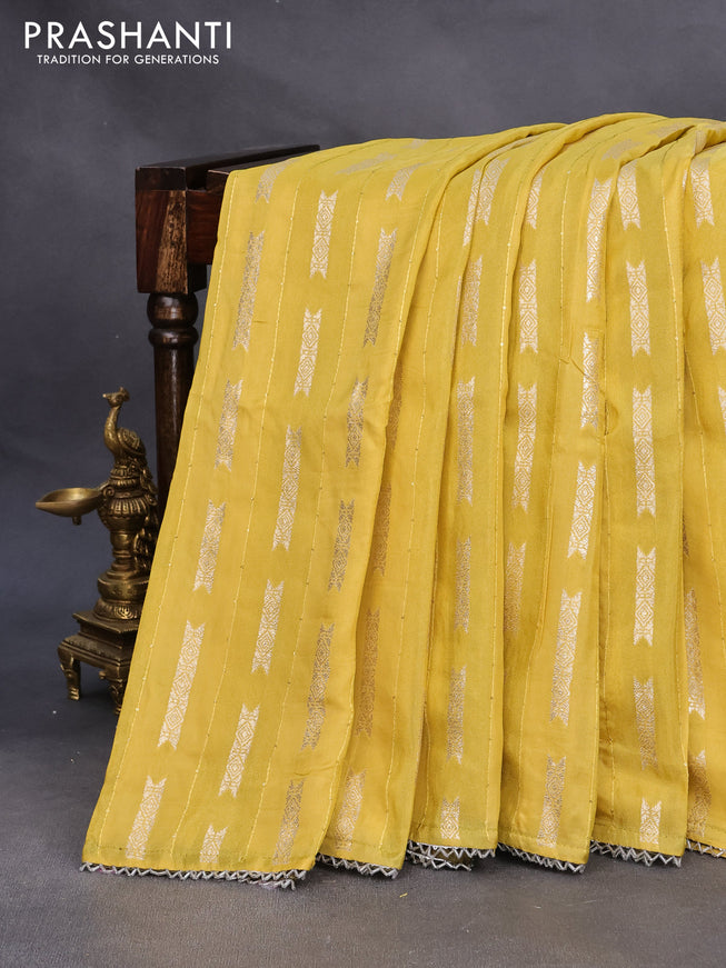 Raw silk saree yellow and mehendi green with allover sequin work & butta weaves and beaded work border