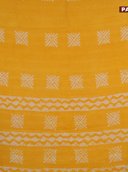 Batik cotton saree yellow with allover sequin work & batik butta prints and printed lace work border