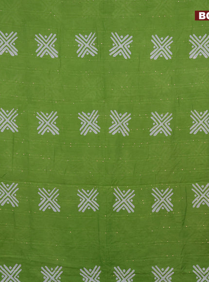 Batik cotton saree green with allover sequin work & batik butta prints and printed lace work border