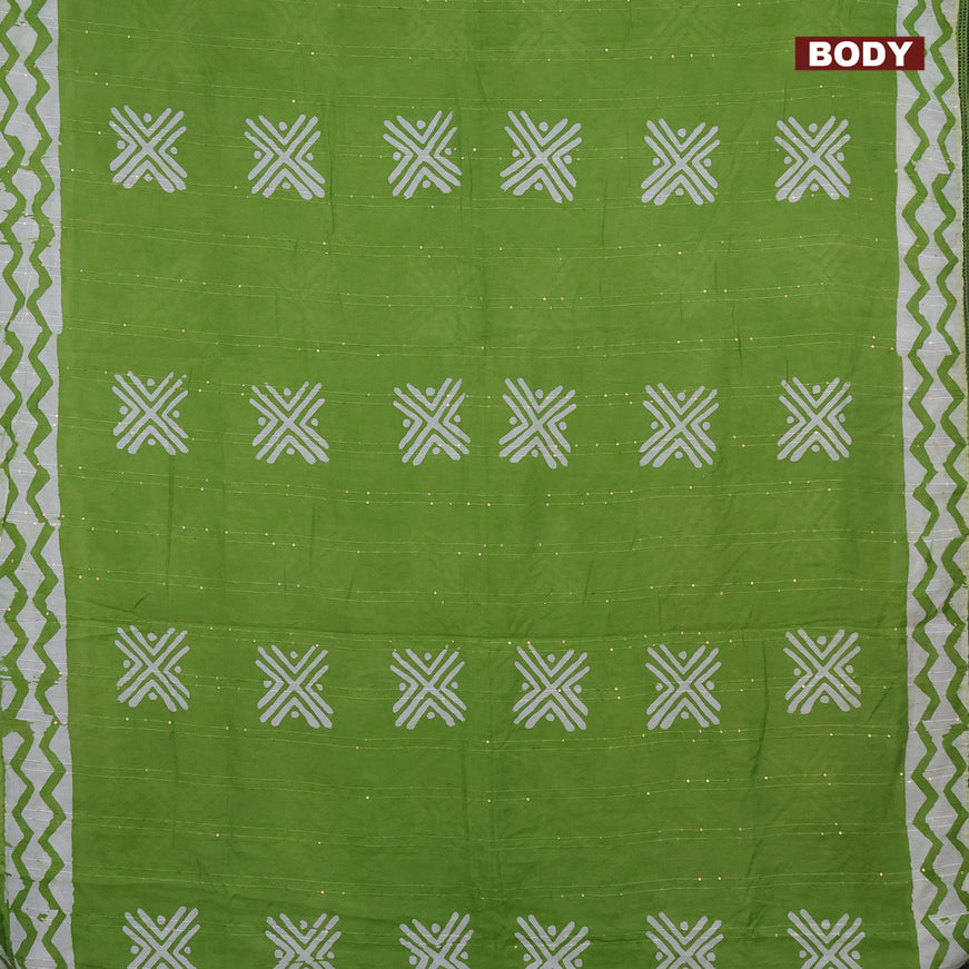 Batik cotton saree green with allover sequin work & batik butta prints and printed lace work border