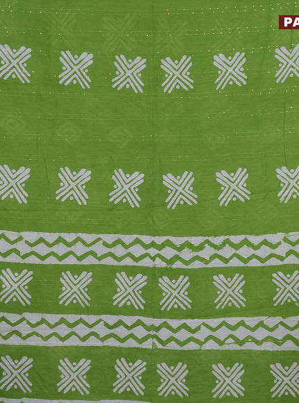 Batik cotton saree green with allover sequin work & batik butta prints and printed lace work border