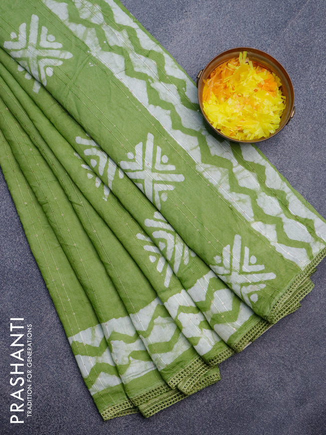 Batik cotton saree light green with allover sequin work & batik butta prints and printed lace work border