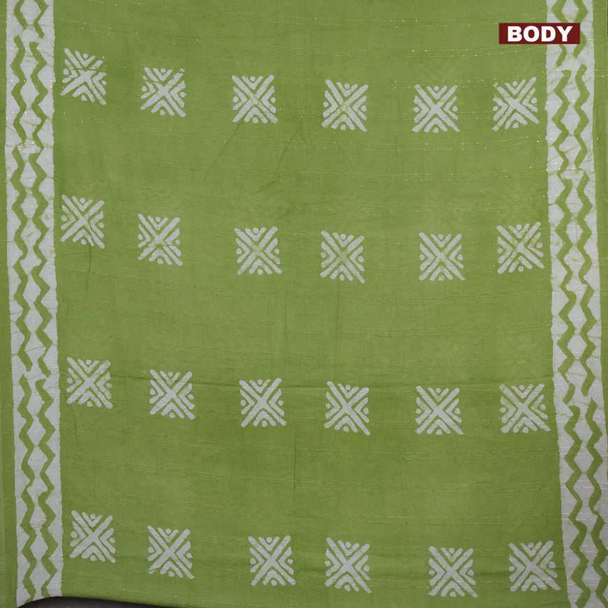 Batik cotton saree light green with allover sequin work & batik butta prints and printed lace work border