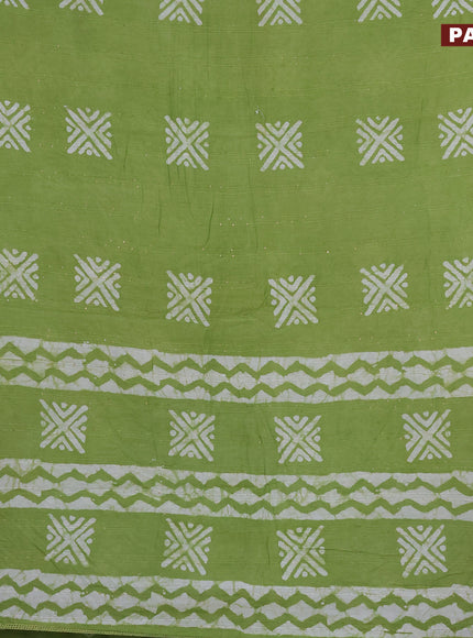 Batik cotton saree light green with allover sequin work & batik butta prints and printed lace work border