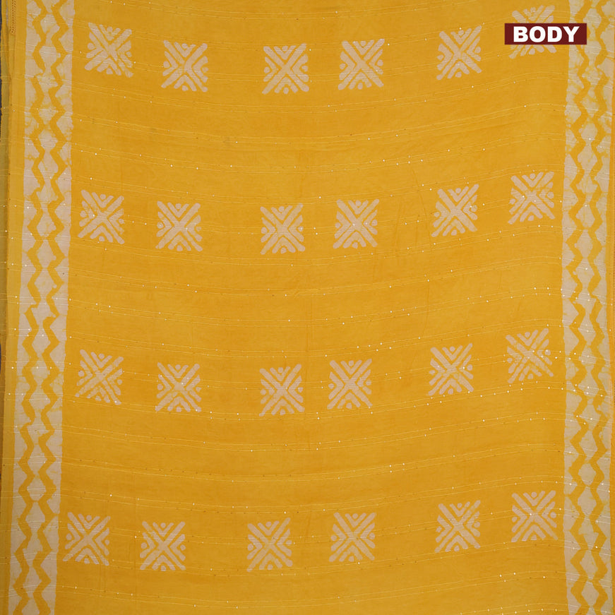 Batik cotton saree yellow with allover sequin work & batik butta prints and printed lace work border