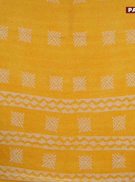 Batik cotton saree yellow with allover sequin work & batik butta prints and printed lace work border