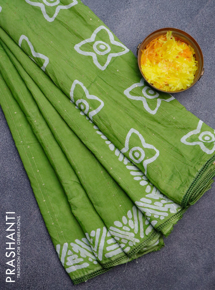 Batik cotton saree light green with allover sequin work & batik butta prints and printed lace work border