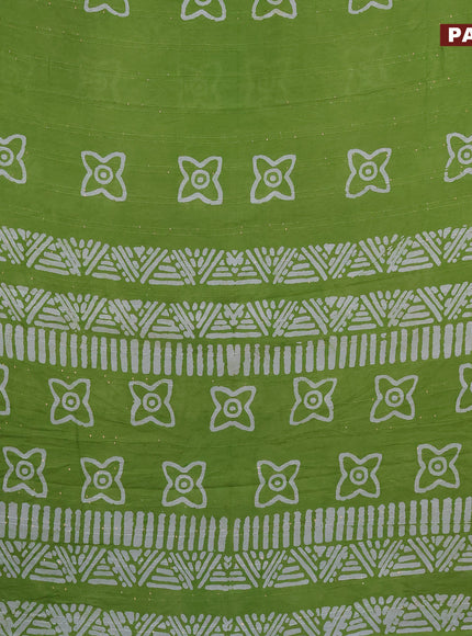 Batik cotton saree light green with allover sequin work & batik butta prints and printed lace work border