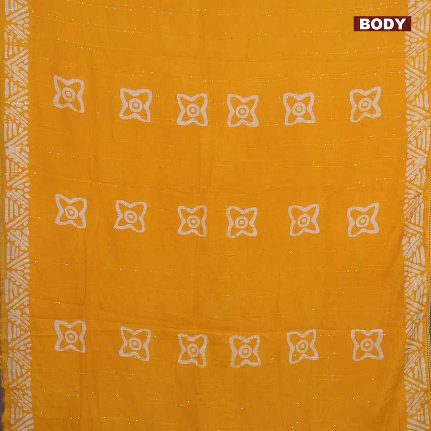 Batik cotton saree yellow with allover sequin work & batik butta prints and printed lace work border