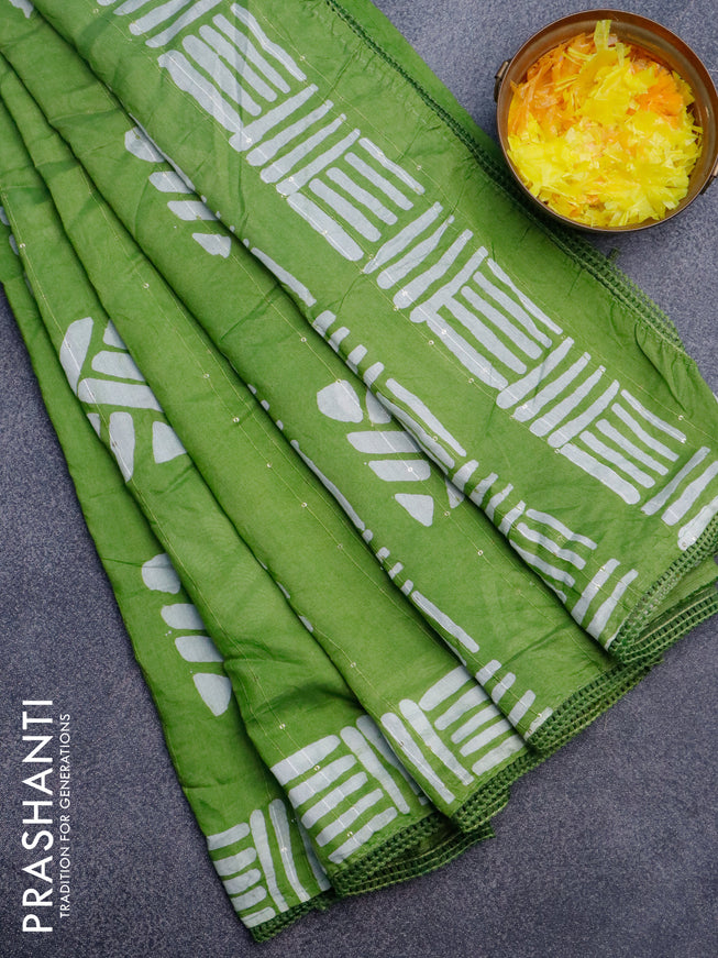 Batik cotton saree light green with allover sequin work & batik butta prints and printed lace work border