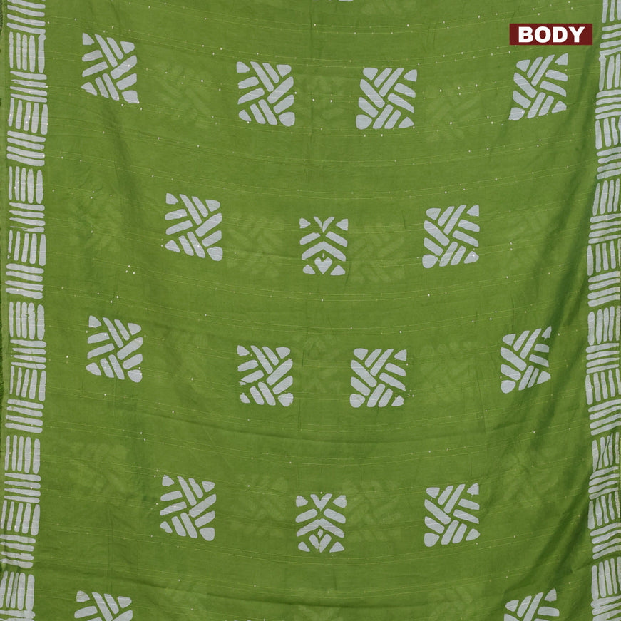 Batik cotton saree light green with allover sequin work & batik butta prints and printed lace work border