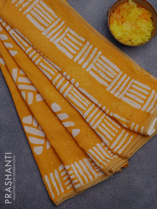 Batik cotton saree yellow with allover sequin work & batik butta prints and printed lace work border