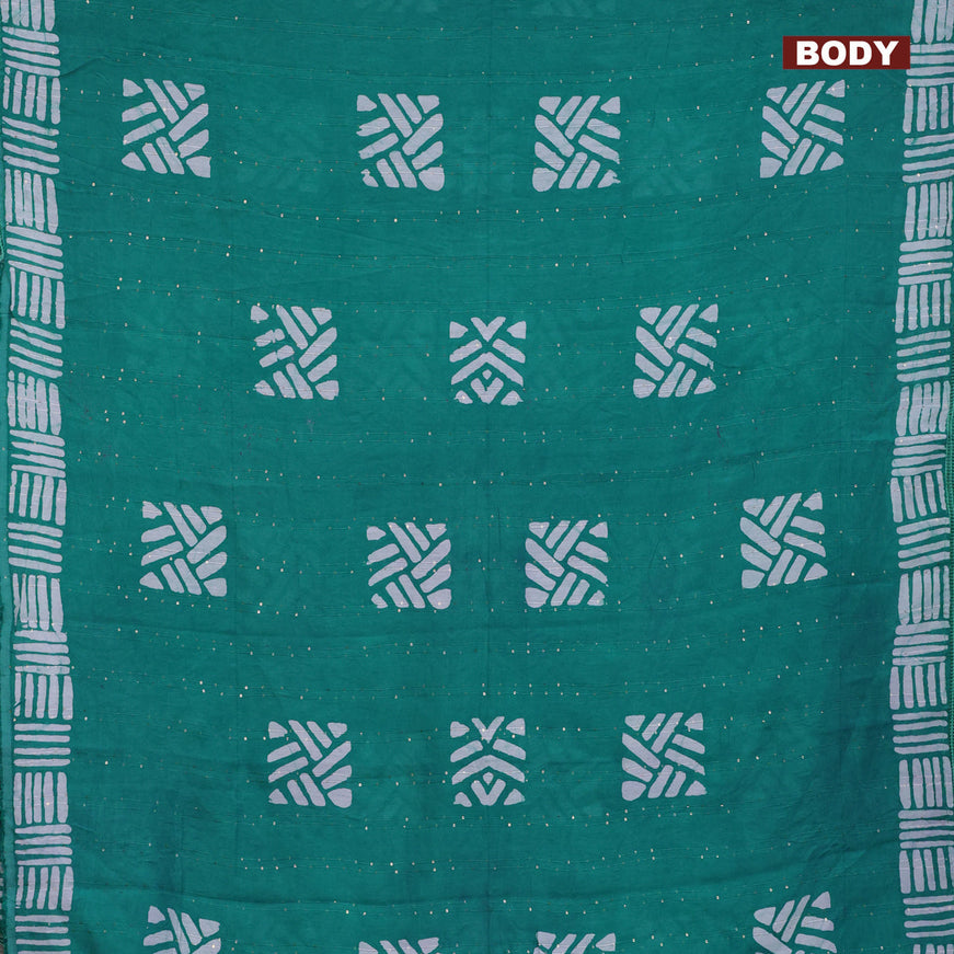 Batik cotton saree teal green with allover sequin work & batik butta prints and printed lace work border