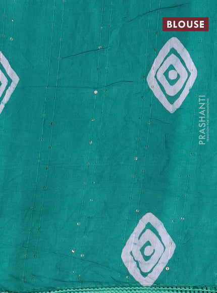 Batik cotton saree teal green with allover sequin work & batik butta prints and printed lace work border