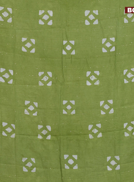 Batik cotton saree light green with allover sequin work & batik butta prints and printed lace work border