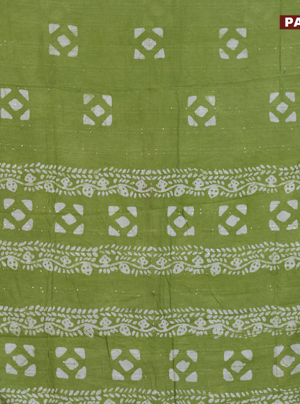 Batik cotton saree light green with allover sequin work & batik butta prints and printed lace work border