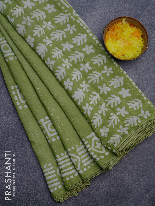 Batik cotton saree light green with allover sequin work & batik butta prints and printed lace work border