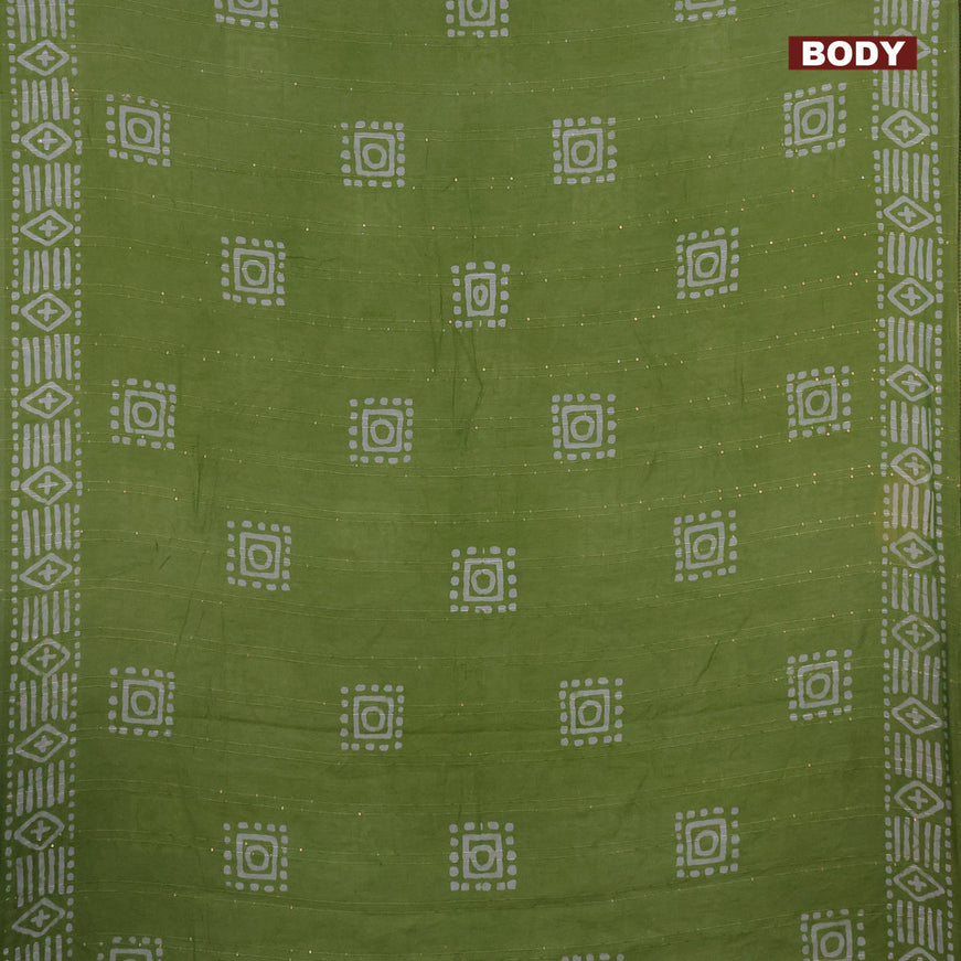 Batik cotton saree light green with allover sequin work & batik butta prints and printed lace work border