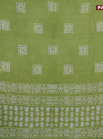 Batik cotton saree light green with allover sequin work & batik butta prints and printed lace work border