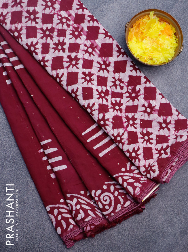 Batik cotton saree wine shade with allover sequin work & batik butta prints and printed lace work border