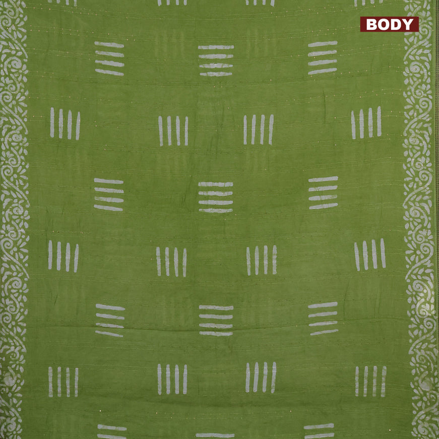 Batik cotton saree light green with allover sequin work & batik butta prints and printed lace work border