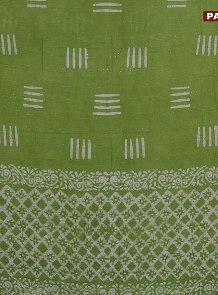 Batik cotton saree light green with allover sequin work & batik butta prints and printed lace work border