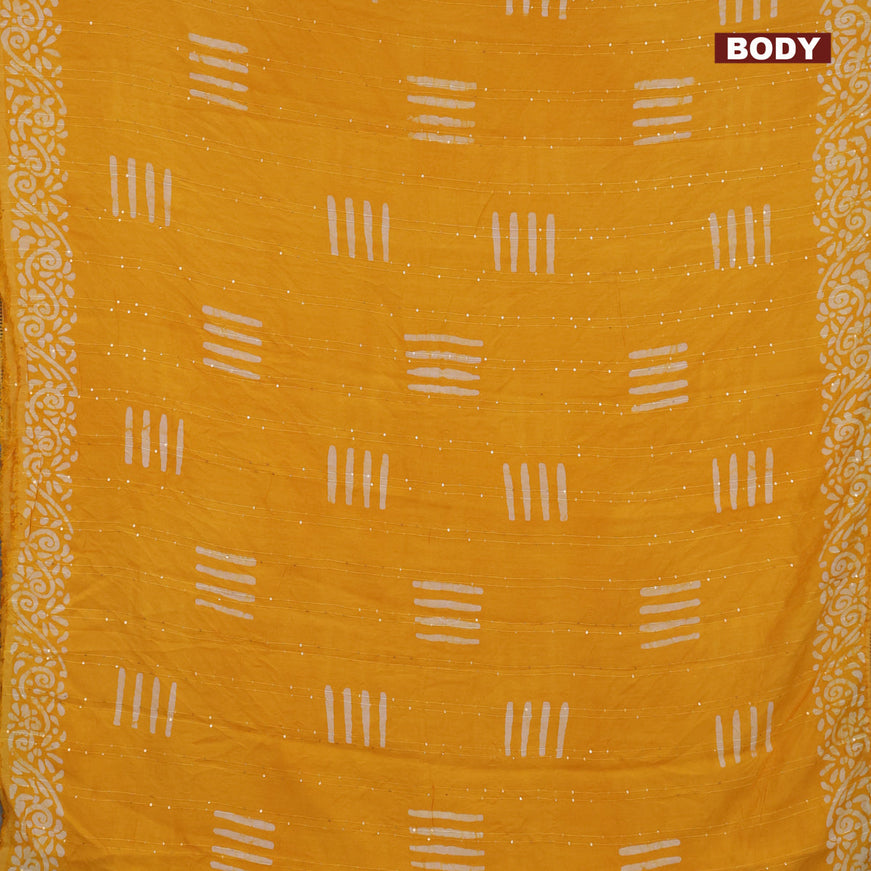 Batik cotton saree yellow with allover sequin work & batik butta prints and printed lace work border