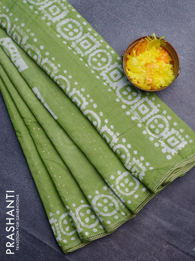 Batik cotton saree light green with allover sequin work & batik butta prints and printed lace work border