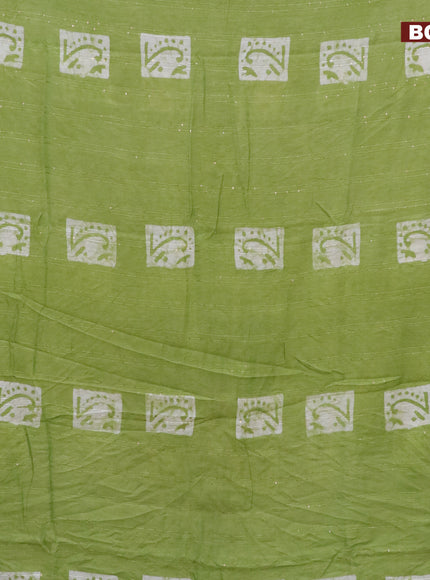 Batik cotton saree light green with allover sequin work & batik butta prints and printed lace work border